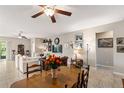 Open living space with dining table, neutral walls and plenty of natural light at 6124 35Th E Ct, Bradenton, FL 34203
