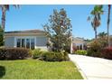 Inviting home showcasing well-maintained landscaping, a spacious driveway, and an attractive front facade at 8711 51St E Ter, Bradenton, FL 34211