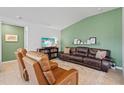 Inviting living room featuring a comfortable leather sofa and recliners perfect for relaxation at 11571 Little River Way, Parrish, FL 34219