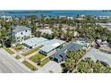 A beautiful coastal home and community offers lovely nearby water views at 148 N Blvd Of The Presidents, Sarasota, FL 34236