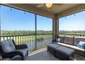 Screened-in lanai provides stunning golf course views with a ceiling fan and comfortable seating at 17810 Gawthrop Dr # 406, Bradenton, FL 34211
