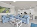 Cozy living room with two sofas open to a bright kitchen, perfect for relaxation and entertaining at 17810 Gawthrop Dr # 406, Bradenton, FL 34211