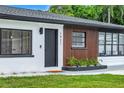 Close up of the exterior showcasing the freshly painted trim and wood siding at 1921 Fern Ave, Sarasota, FL 34235