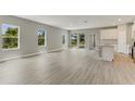 Spacious living area features lots of natural light and access to a kitchen at 2290 Beeville Ave, North Port, FL 34286