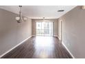 Spacious open concept living area with lots of natural light, a ceiling fan, and direct access to an outdoor balcony at 2300 Stickney Point Rd # 125, Sarasota, FL 34231