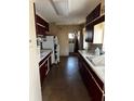 Functional kitchen featuring ample cabinets and a double door refrigerator at 2503 23Rd W Ave, Bradenton, FL 34205