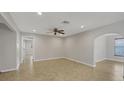 Spacious living room featuring neutral paint, recessed lighting, and tile floors at 2536 Carlisle Pl, Sarasota, FL 34231