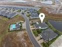 Aerial view of single-Gathering homes and new construction featuring several large ponds at 256 Van Gogh Cv, Bradenton, FL 34212