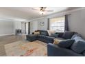 Inviting living room with cozy seating area, stylish rug, and ample natural light at 508 70Th St, Holmes Beach, FL 34217