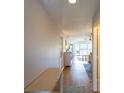 Bright condo hallway with recessed lighting and hardwood floors leading to an inviting living space at 5630 Golf Pointe Dr # 206, Sarasota, FL 34243