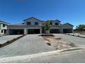 New construction home featuring a stone driveway and modern gray exterior paint at 5632 Summit Pointe Cir # 101, Bradenton, FL 34210