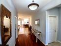 Stylish foyer with polished wood floors and tasteful decor sets the tone for a well-maintained home at 6631 63Rd E Ter, Bradenton, FL 34203
