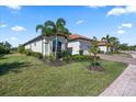 Well-maintained lawn, meticulous landscaping and a paver driveway compliment this home at 7113 Whittlebury Trl, Bradenton, FL 34202