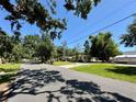 Charming home nestled among lush trees in a quiet residential neighborhood street at 1317 Venetia St, Nokomis, FL 34275