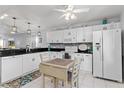 Bright kitchen featuring white cabinets and modern appliances at 175 Kings Hwy # 428 B8, Punta Gorda, FL 33983