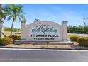 Newport Condominiums & St. James Place sign with colorful landscaping at 175 Kings Hwy # 428 B8, Punta Gorda, FL 33983