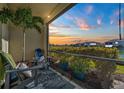 Relaxing screened patio overlooking manicured yard and beautiful sunset views at 20228 Lagente Cir, Venice, FL 34293