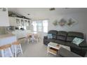 Open-concept living space features an adjacent kitchen and dining area, perfect for entertaining at 3333 26Th E Ave # 1257, Bradenton, FL 34208