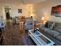 Cozy living room with neutral tones, comfortable seating, and plenty of natural light at 425 30Th W Ave # C104, Bradenton, FL 34205