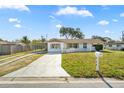 Charming single-story home featuring a well-maintained lawn and a convenient carport at 432 Crosby Ct, Sarasota, FL 34237
