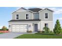 Beautiful home with a two-car garage, green lawn, and colorful landscaping at 4618 Hawthorn Ave, Parrish, FL 34219