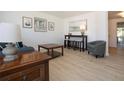 Bright living room featuring neutral walls, updated flooring, and tasteful decor at 466 Sunnyside Dr, Venice, FL 34293