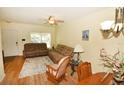Comfortable living room with neutral tones, laminate flooring, and lots of natural light at 4754 Sabal Key Dr, Bradenton, FL 34203