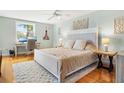 Cozy bedroom with hardwood floors, neutral walls, and a work space near the window for functionality at 5014 Marshfield Rd # 30, Sarasota, FL 34235