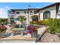 A stunning backyard oasis with a large pool and lush landscaping perfect for relaxation and entertainment at 524 Schooner Ln, Longboat Key, FL 34228