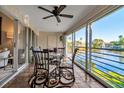 Enclosed lanai boasts tile flooring, a ceiling fan and views of the fountain and lake at 6101 34Th W St # 9C, Bradenton, FL 34210