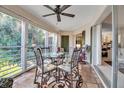 Enclosed lanai boasts tile flooring and serene outdoor views at 6101 34Th W St # 9C, Bradenton, FL 34210
