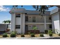Exterior view of a well-maintained two-story condominium with mature landscaping at 10415 Waterbird Way # 10415, Bradenton, FL 34209