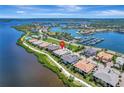 Beautiful aerial view of waterfront homes with a marina, a river, and a neighborhood pool at 1264 Riverscape St # B, Bradenton, FL 34208