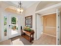 Inviting foyer with tile flooring, natural light, and a decorative console table at 251 Dove Trl, Bradenton, FL 34212