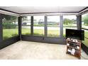 Bright sunroom with large windows offering panoramic views of the surrounding neighborhood at 2614 67Th W St, Bradenton, FL 34209