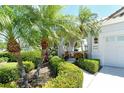Charming single-Gathering home with landscaped front yard and a covered entry area, perfect for curb appeal at 3870 Alamanda Dr, Sarasota, FL 34238
