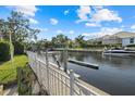 Waterfront property featuring a private boat dock on a serene canal with easy access to boating and water activities at 4715 Spinnaker Dr, Bradenton, FL 34208