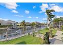 Scenic view of a canal with boat dock, lush greenery, and waterfront homes offering a serene coastal lifestyle at 4715 Spinnaker Dr, Bradenton, FL 34208