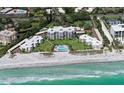 Panoramic aerial view showcases well-maintained condos, lawn, pool, and beach access at 4835 Gulf Of Mexico Dr # 106, Longboat Key, FL 34228