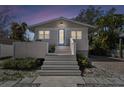 Inviting front exterior view featuring a symmetrical facade, gray stairs, and a welcoming entrance at 652 Ohio Pl, Sarasota, FL 34236