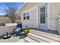 Cozy front porch area with comfortable chairs, stylish flooring, and inviting entryway at 652 Ohio Pl, Sarasota, FL 34236