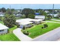 Aerial shot of a well-maintained home featuring lush greenery, and a long driveway at 7114 11Th W Ave, Bradenton, FL 34209
