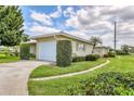 Charming home featuring an attached garage, lush landscaping, and a welcoming curb appeal at 7114 11Th W Ave, Bradenton, FL 34209