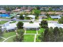 Aerial view showcasing a home with manicured landscaping within a peaceful residential neighborhood at 7114 11Th W Ave, Bradenton, FL 34209