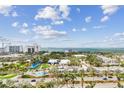 Scenic aerial view of a coastal community featuring parks, buildings, and waterfront vistas at 750 N Tamiami Trl # 1203, Sarasota, FL 34236