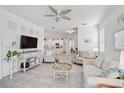 Bright living room with tile floors, ceiling fan, and decorative accents at 8553 Whispering St, Sarasota, FL 34240