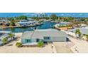 Charming waterfront home with well-maintained landscaping, private dock, and beautiful canal views at 10008 Spoonbill E Rd, Bradenton, FL 34209