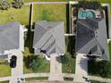 An aerial view showcases the house and the lot, along with neighbors at 10934 79Th E St, Parrish, FL 34219