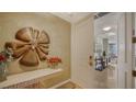 Inviting entryway with elegant decor, marble accents and views into the living space at 1241 Gulf Of Mexico Dr # 603, Longboat Key, FL 34228