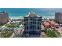 A multi-story condominium building with stunning beachfront views and a luxurious pool at 1241 Gulf Of Mexico Dr # 603, Longboat Key, FL 34228